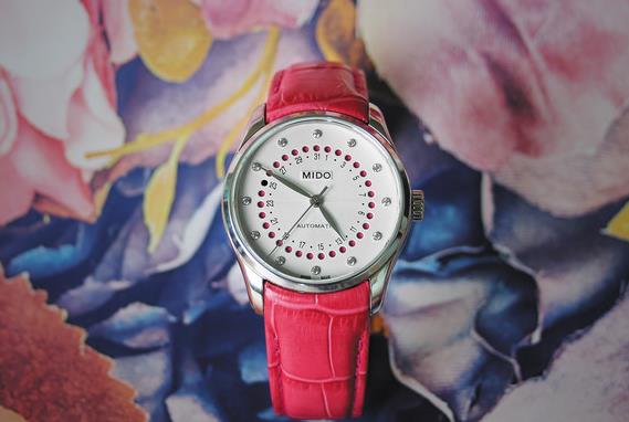 The stainless steel copy watches have pink leather straps.